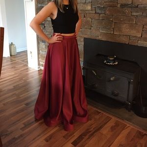 Formal two piece gown.Top has zipper in back with 4 cut outs.